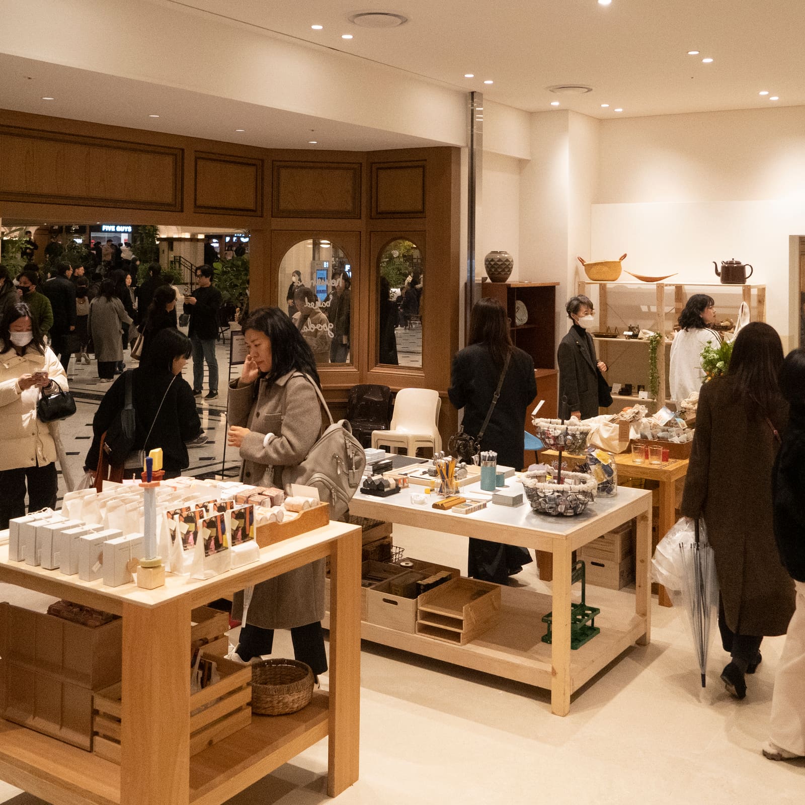 Visitors browsing food and household goods at the Shinsegae Gangnam pop-up