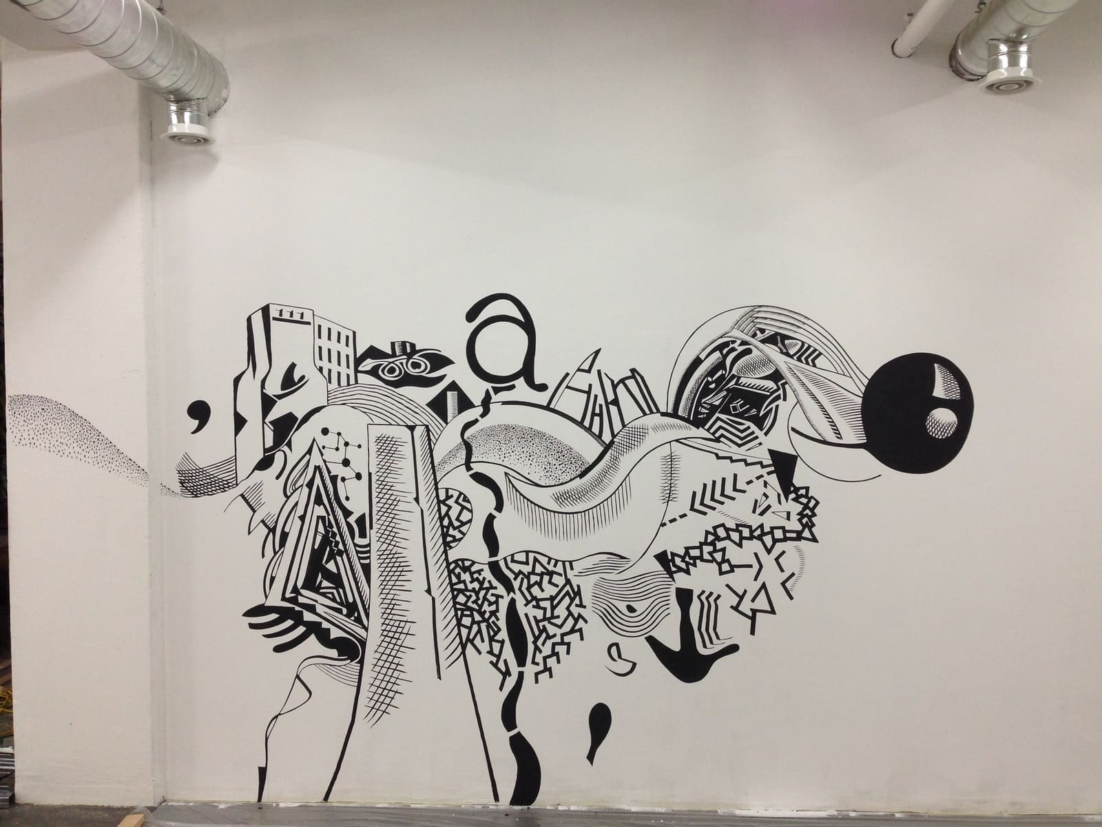 Large black line mural on a white wall