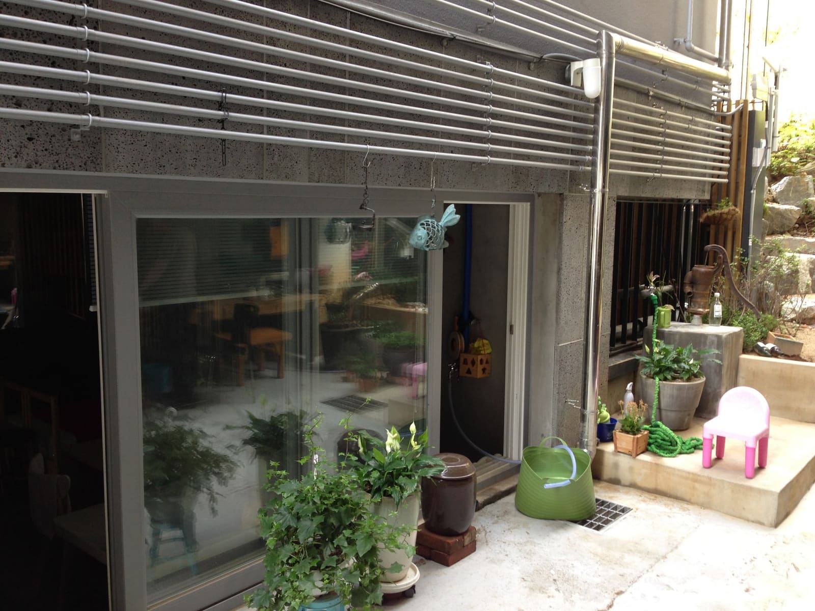 Entrance of Place Sai with potted plants