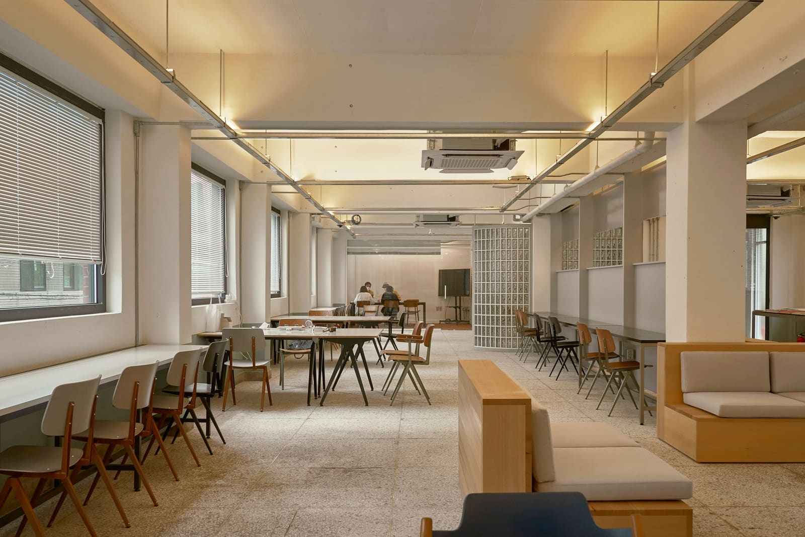Long interior with windows and a row of lights