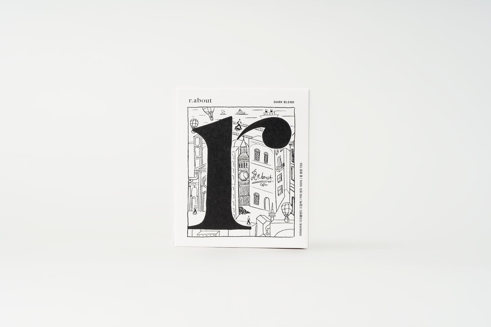 r.about dark-blend drip coffee pack with a black r illustration