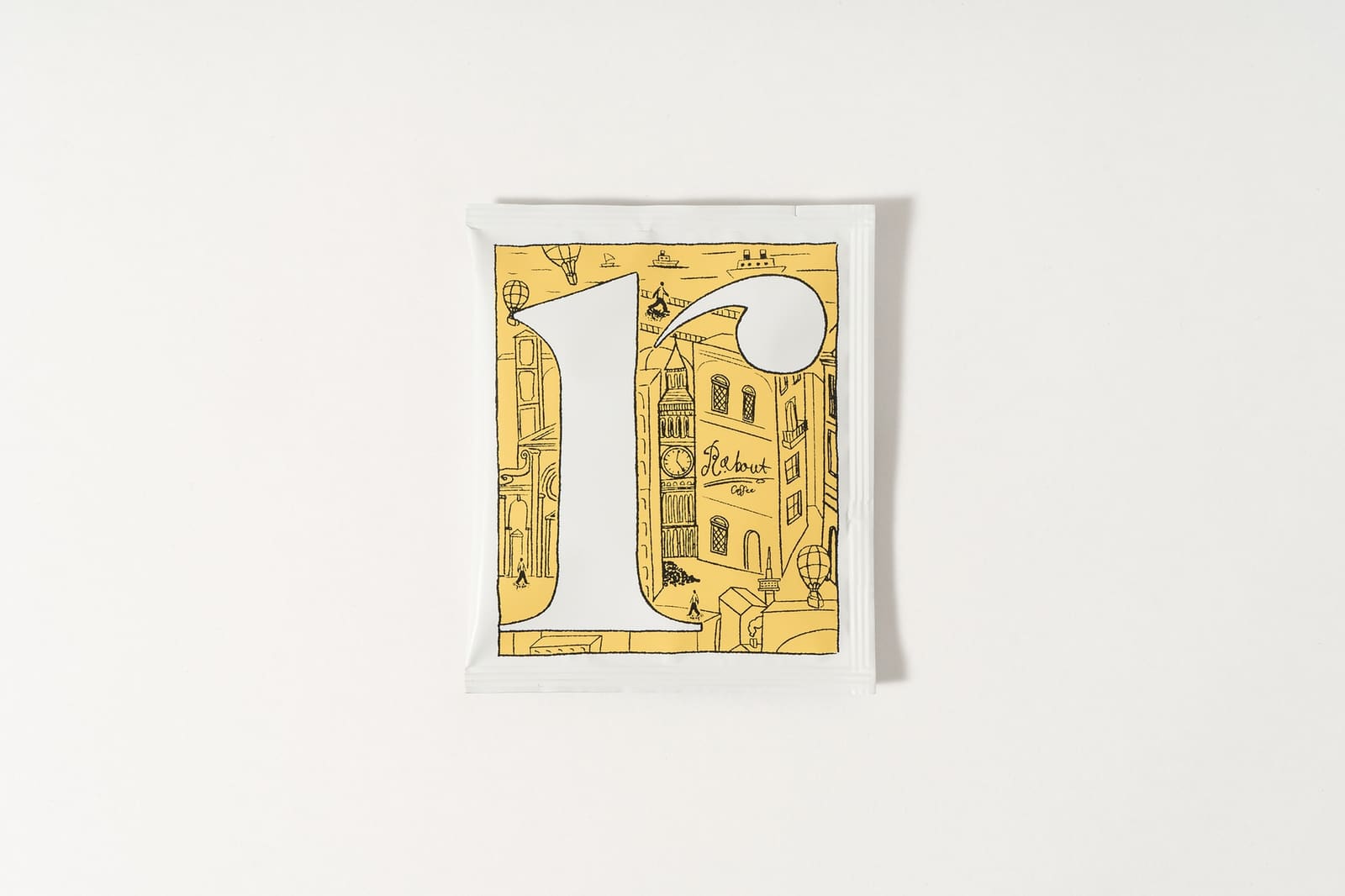 r.about house-blend drip coffee pouch with a yellow r illustration